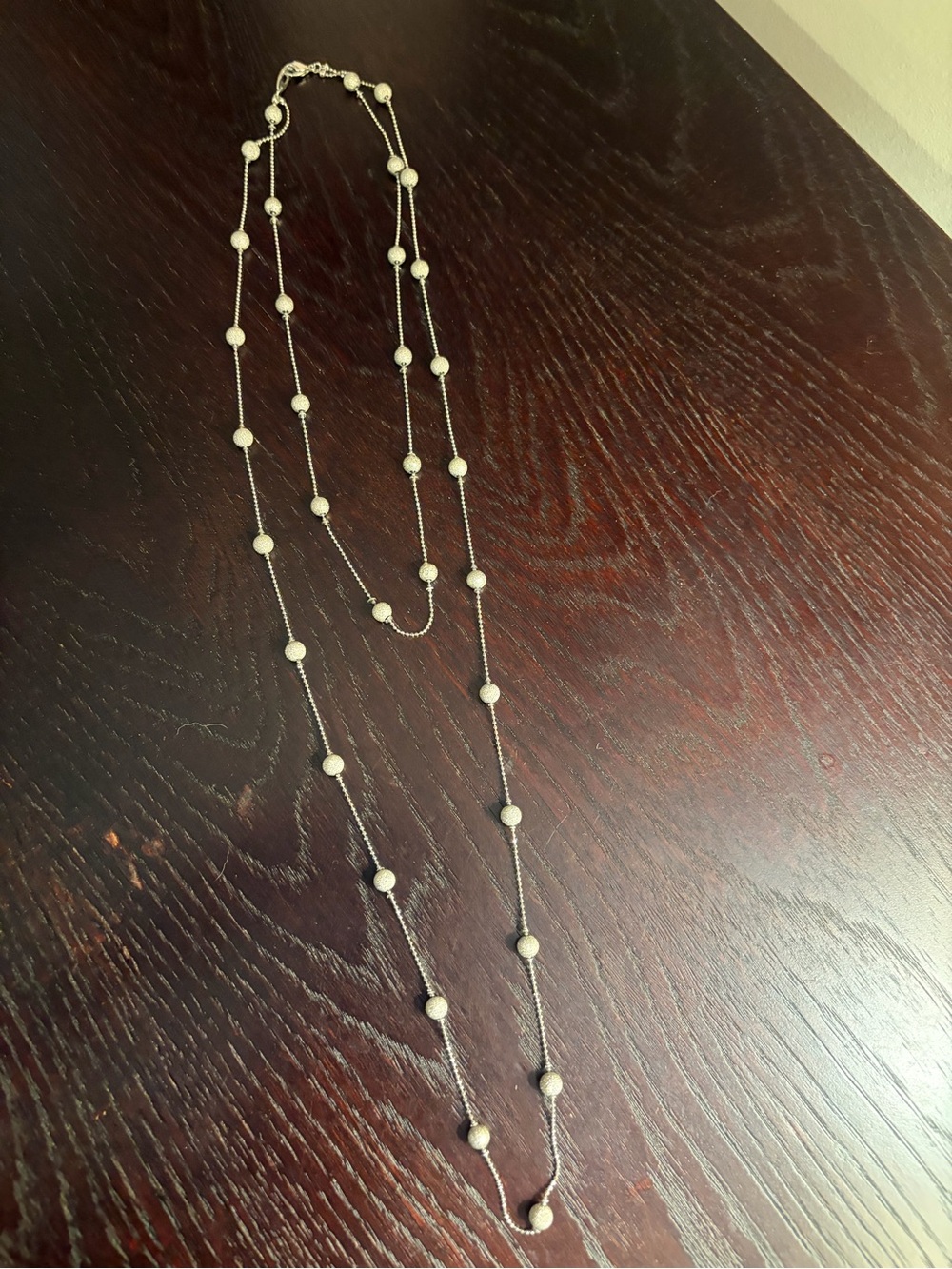Silver double layered necklace with sparkly silver balls.